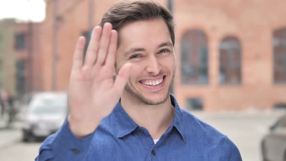 Hello Welcoming Young Man Standing Outdoor