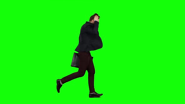 Man Is Running a Briefcase in His Hand, He Rushes Over It. Green Screen