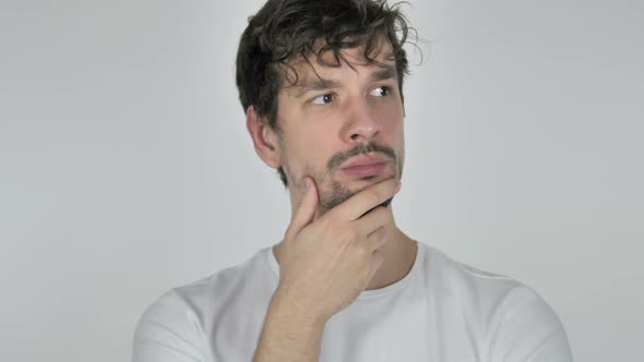 Portrait of Thinking Young Casual Man Having New Idea