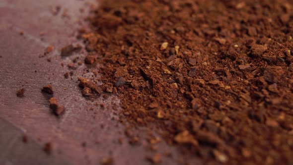 Soluble crushed dried chicory root on a wooden surface. Macro