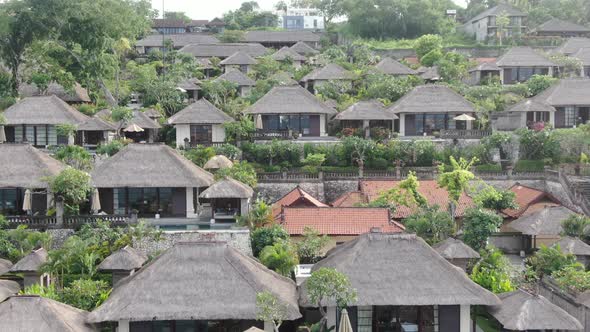 Flight of a Drone Over a Village on the Seashore