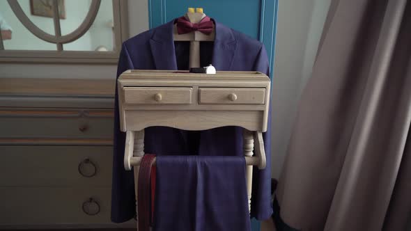 Blue Men's Suit on a Hanger