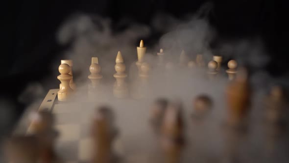 Close Up of White Chess Pieces on Board with Dissipating Steam