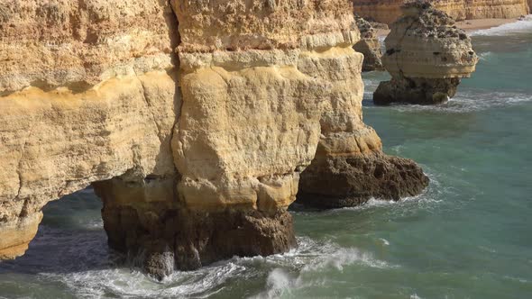 Rock Cliffs and Waves Near in Algarve Portugal