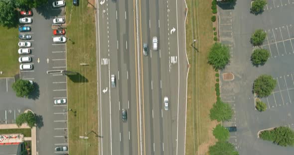 Aerial Panorama View on a Highway Running Through the Small Town Area