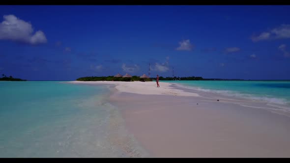 Girls relaxing on tropical shore beach voyage by shallow water and clean sandy background of the Mal