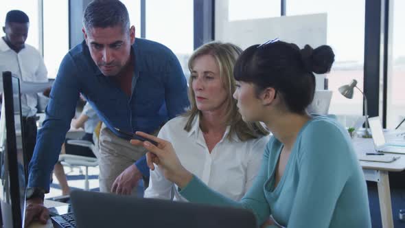 Team working on computer at the office