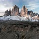 Aerial Man Hiker Walk In Front of Tre Cime di Lavaredo Mountain in Dolomites Italy - VideoHive Item for Sale