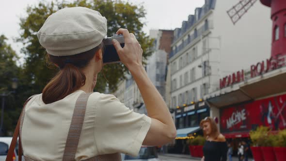 Young tourist taking photo in Montmartre