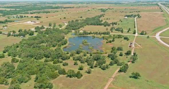 Panorama Top View of Oil Pump in the Countryside the Small Pond of Original Route 66 Roadbed Near