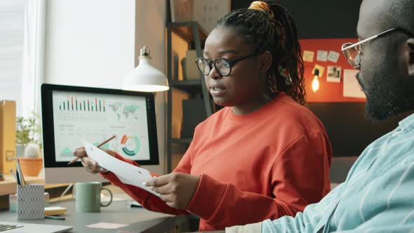 African American Coworkers Discussing Business Plan