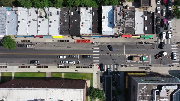 A top down shot over Fulton Street in Bedford Stuyvesant, Brooklyn. The camera is looking straight d