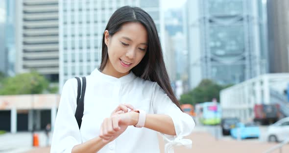 Businesswoman look at the smart watch