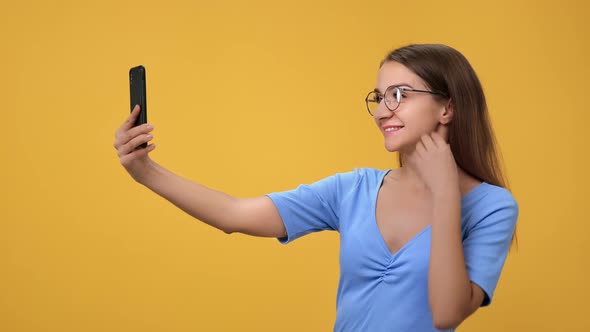 Happy Woman in Eyeglasses Posing Taking Selfie Use Smartphone Peace Greeting Gesture Isolated