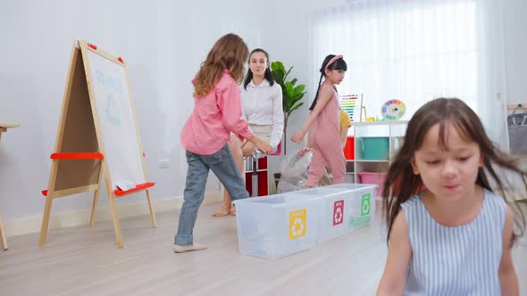 Caucasian beautiful woman teacher teaching a lesson to kid at school.