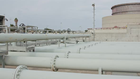Large crude oil storage tanks in a huge refinery