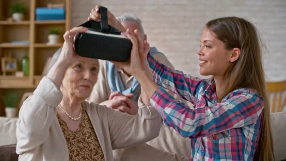 Woman Experiencing Virtual Reality with Grandparents