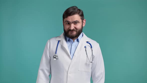 Portrait of Satisfied Doctor in Professional Medical Coat Showing Yes Sign By Head