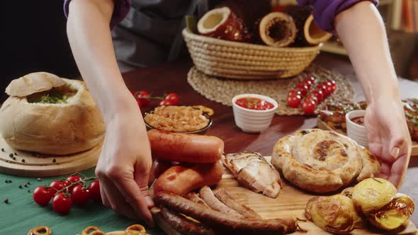 Putting Fried Sausages Closeup