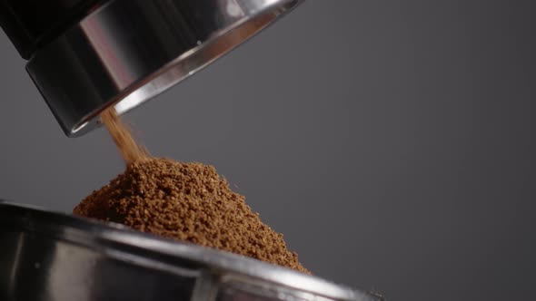 Grinder Making Coffee Powder Grinding Aromatic Beans in Filter Holder Close Up