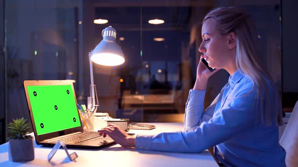 Businesswoman with Green Screen on Laptop at Night 18