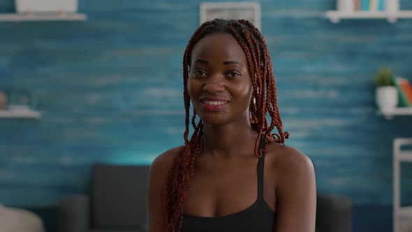 Portrait of Black Woman Smiling and Looking Into Camera During Fitness Morning Workout