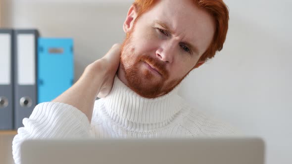 Man with Red Hairs Relaxing at Work