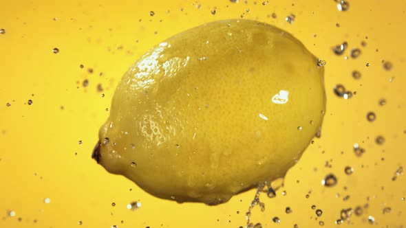 Flying of Lemon in Yellow Background in Slow Motion