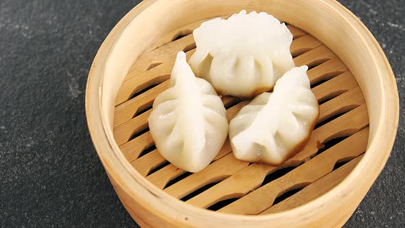 Steamed dumplings in bamboo steamer