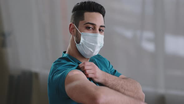 Inspired Arabian Hispanic Man Young Male Practitioner Nurse Intern in Medical Face Mask Showing