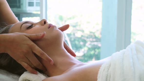 Woman Gets Facial and Head Massage in Luxury Spa