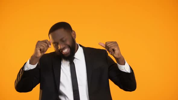 Cheerful Black Male in Formalwear Dancing Celebrating Promotion, Salary Increase