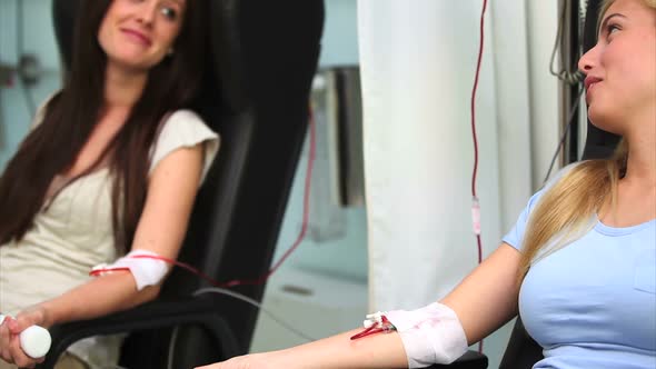 Two patients receiving a transfusion