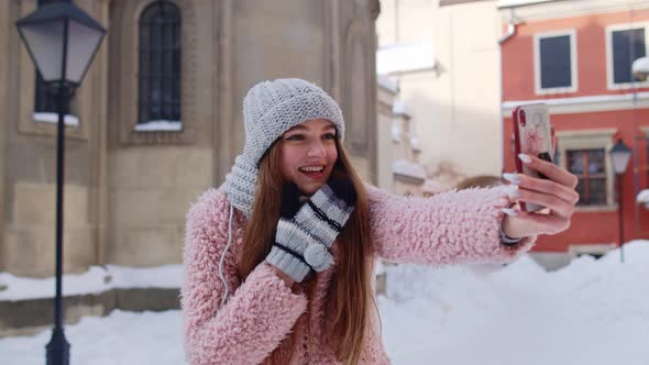 Tourist Girl Blogger Making Video Call on Mobile Phone Chatting with Friends Distance Communication