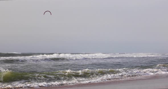 Surfers floating on the waves of the Mediterranean Sea