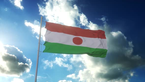 Republic of the Niger Flag Waving at Wind Against Beautiful Blue Sky