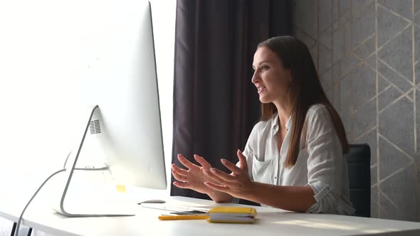 Happy Young Woman Taking a Part in Virtual Meeting Video Calling and Talking Online