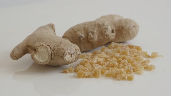 Raw and candied ginger root on the table   slow tilt 4K 2160p 30fps UltraHD footage -  Fresh Zingibe