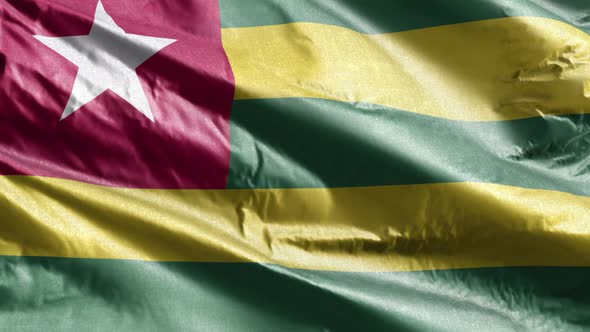 Togo textile flag waving on the wind. Slow motion. 20 seconds loop.