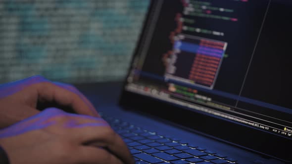 Programmer's Hands and Laptop Keyboard Closeup