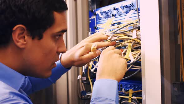 Technician fixing cable