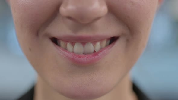 Close Up of Smiling Woman Lips and Teeth