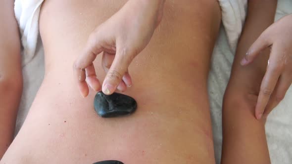 Hot Stone Massage Treatment By Therapist in Spa