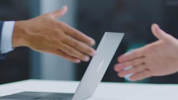 Men shake hands as proof of agreement