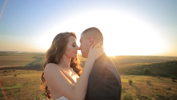 Close Up of Wedding Couple in Embraces Caresses in Embraces