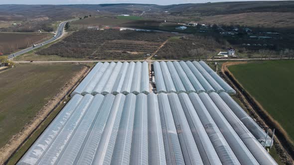 Aerial View of a Greenhouses Lined Up in Row