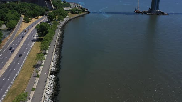 An aerial shot of the shores of Lower New York Bay near Shore Parkway in Brooklyn. It is a sunny day