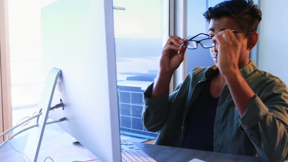 Executive working on computer at desk 4k