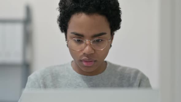 African Woman Having Loss While Using Laptop