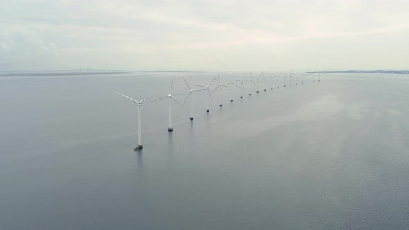 Aerial Footage Of A Windmill Park In The Sea Between Denmark And Swede